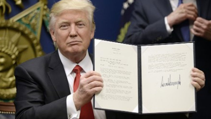 Donald Trump signs revised travel ban Donald Trump signs revised travel ban