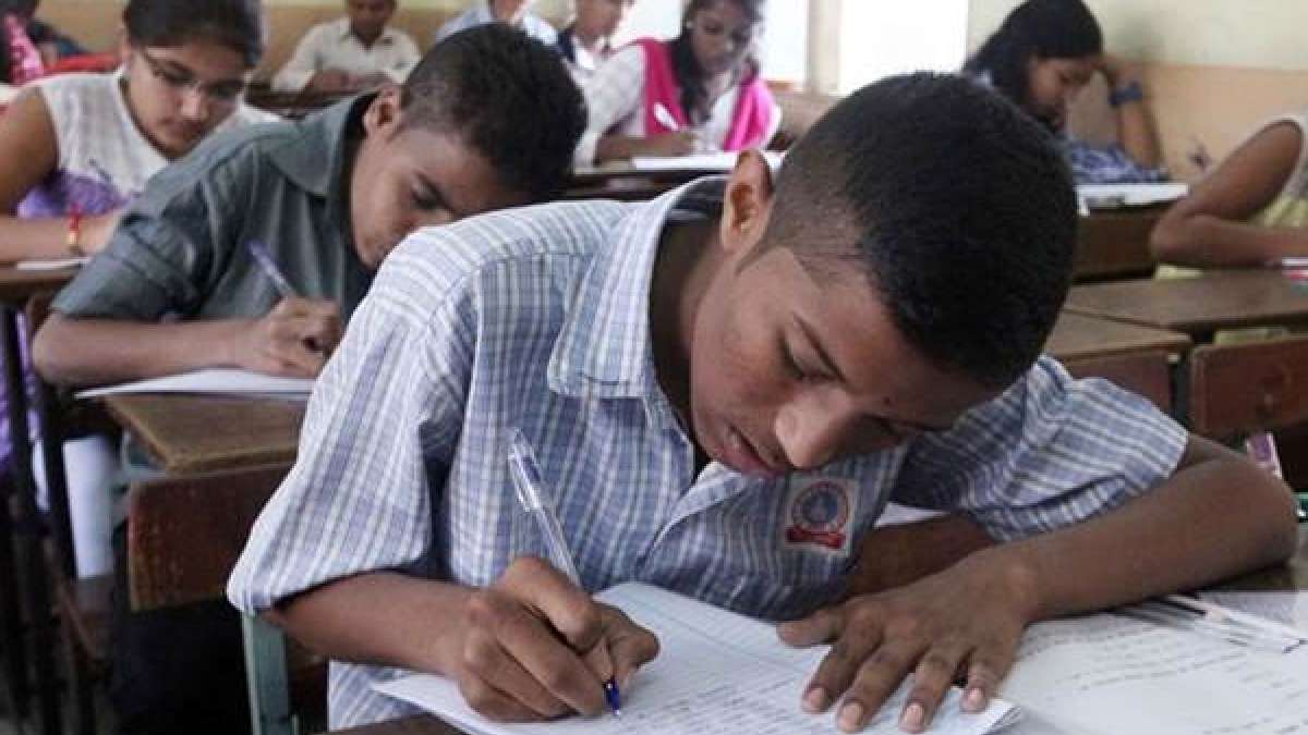 Students appearing for an exam in school Students appearing for an exam in school