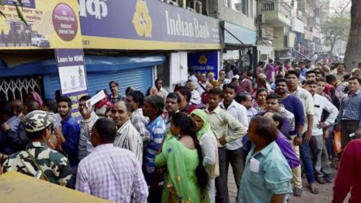 People standing in queues outside banks People standing in queues outside banks