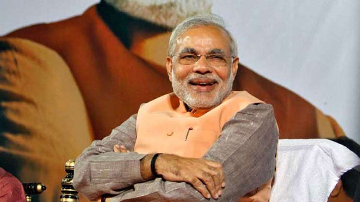 PM Narendra Modi smiling at a function PM Narendra Modi smiling at a function