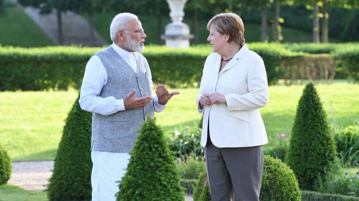 PM Narendra Modi and Angela Merkel in conversation PM Narendra Modi and Angela Merkel in conversation