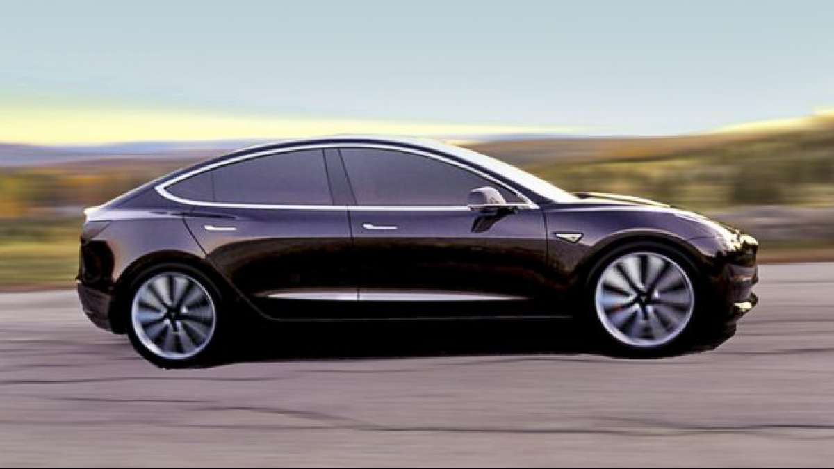 CEO Elon Musk shows off First Tesla Model 3 electric car rolling off production line CEO Elon Musk shows off First Tesla Model 3 electric car rolling off production line