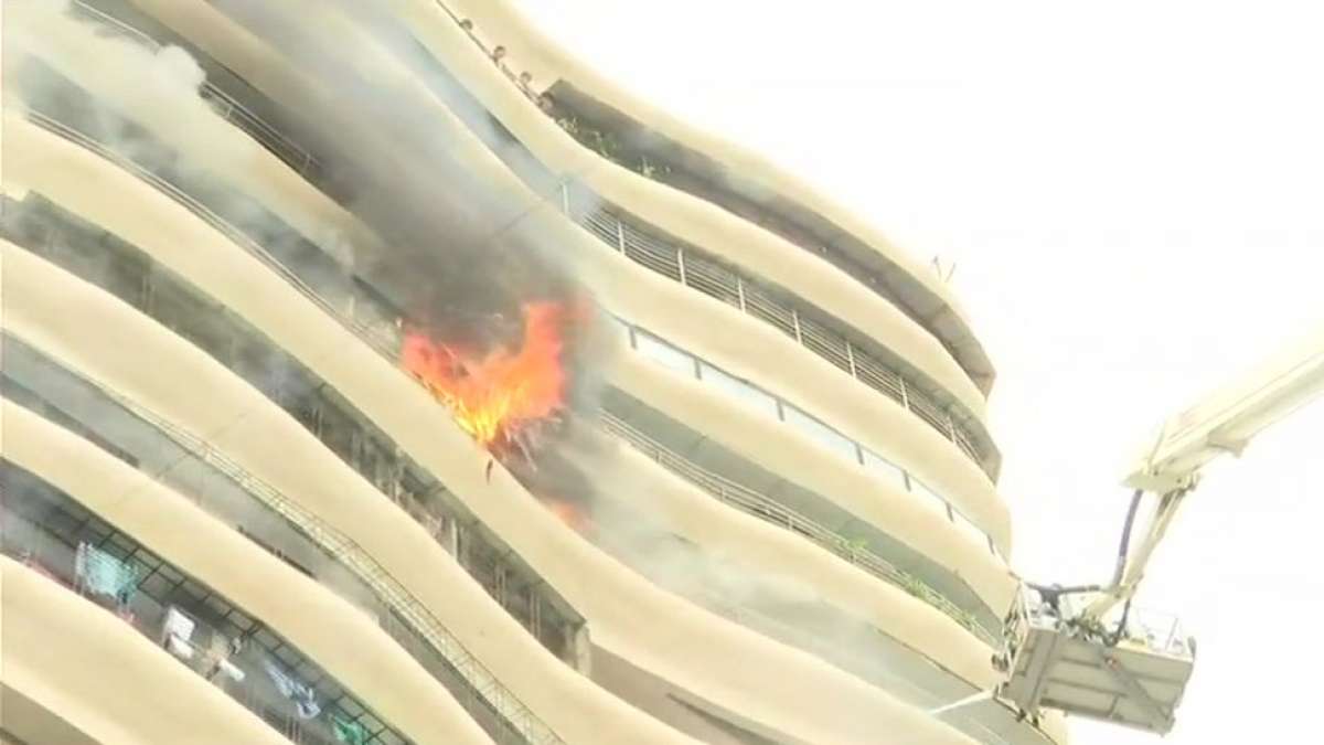 Fire broke on 12th floor of 17-storeyed Crystal Tower building located in Parel, Mumbai Fire broke on 12th floor of 17-storeyed Crystal Tower building located in Parel, Mumbai