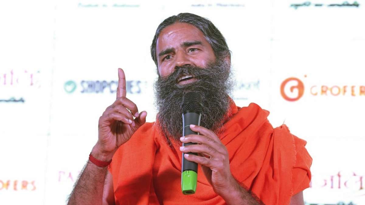 Yoga guru Ramdev draws suspicion over Narendra Modi as next PM Yoga guru Ramdev draws suspicion over Narendra Modi as next PM