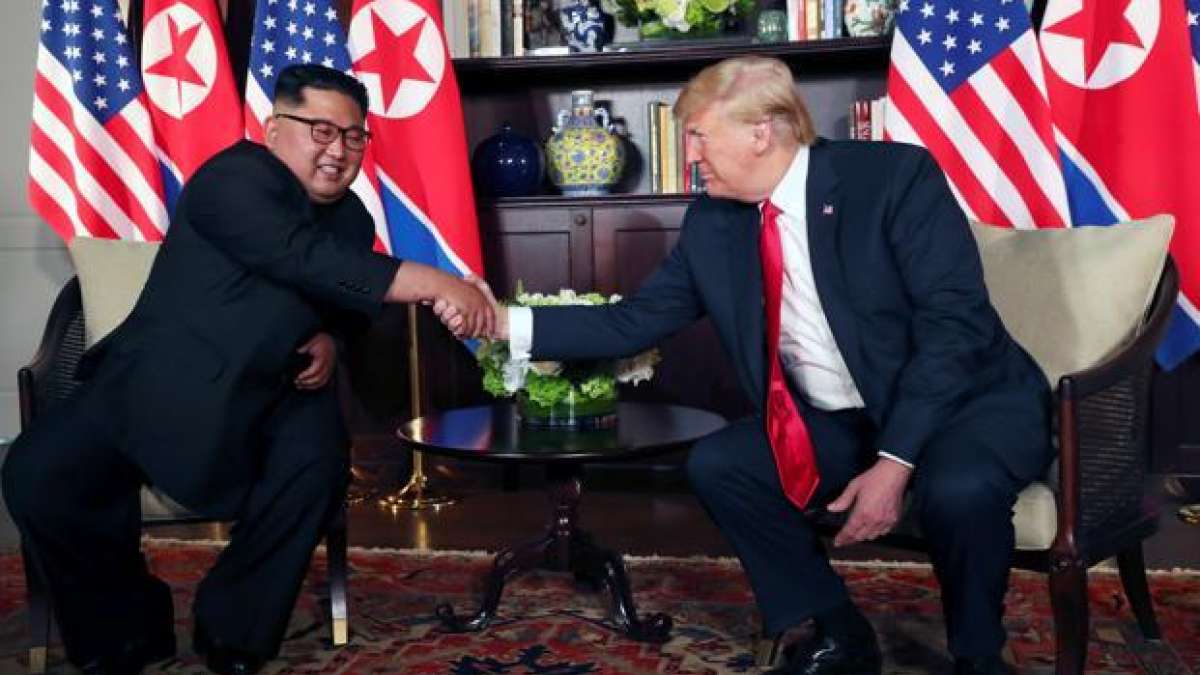 Donald Trump with Kim Jong-un during a summit Donald Trump with Kim Jong-un during a summit