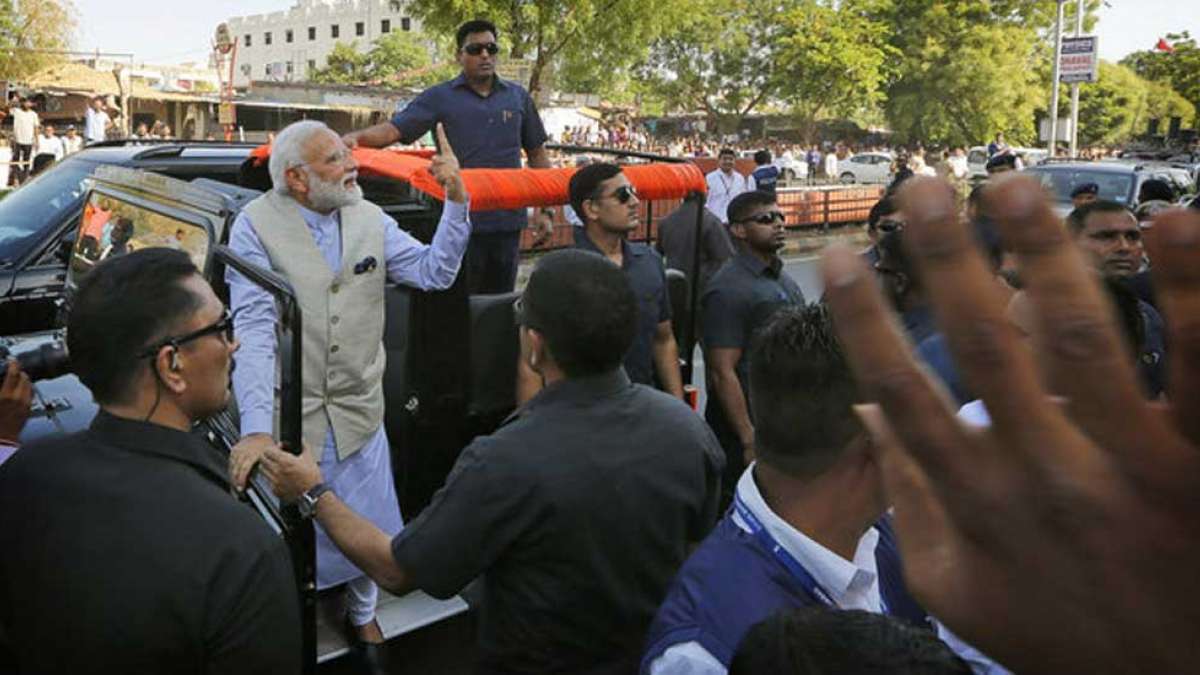 PM Narendra Modi's roadshow after he casted vote in Gujarat PM Narendra Modi's roadshow after he casted vote in Gujarat
