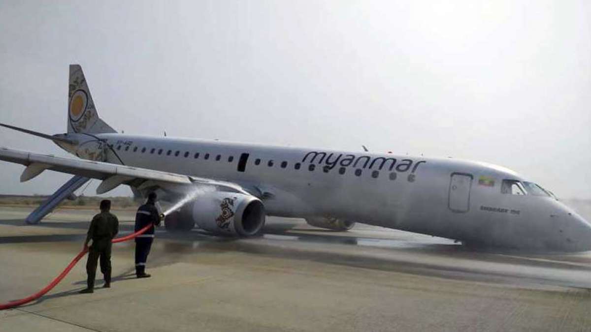Myanmar passenger jet lands safely after landing gear fails (Picture: AP) Myanmar passenger jet lands safely after landing gear fails (Picture: AP)