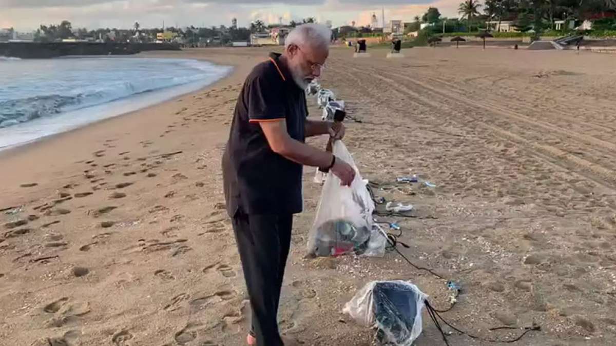 PM Narendra Modi cleans Tamil Nadu beach, shares video PM Narendra Modi cleans Tamil Nadu beach, shares video