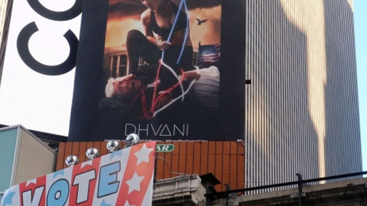 Donald Trump hog-tied by a woman at a Times Square billboard Donald Trump hog-tied by a woman at a Times Square billboard